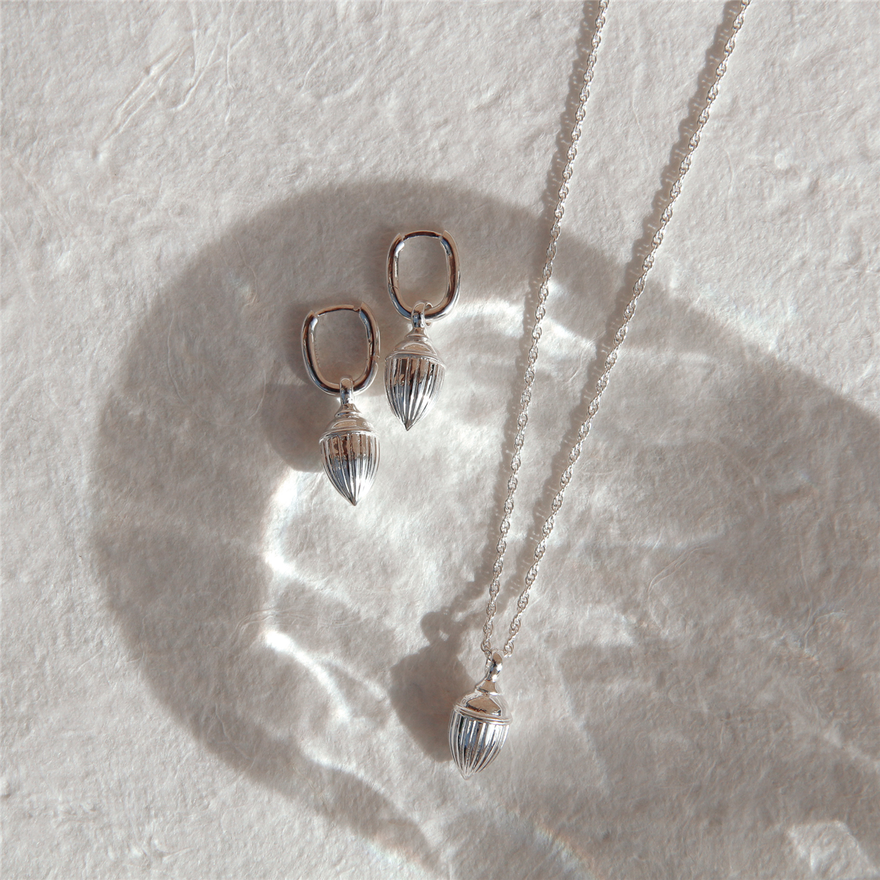 Raya Ridged Pod Huggie Earrings